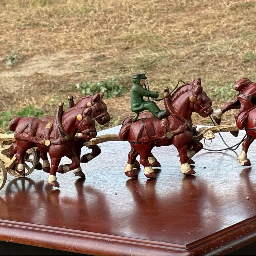 Antique cast iron horse-drawn beer wagon